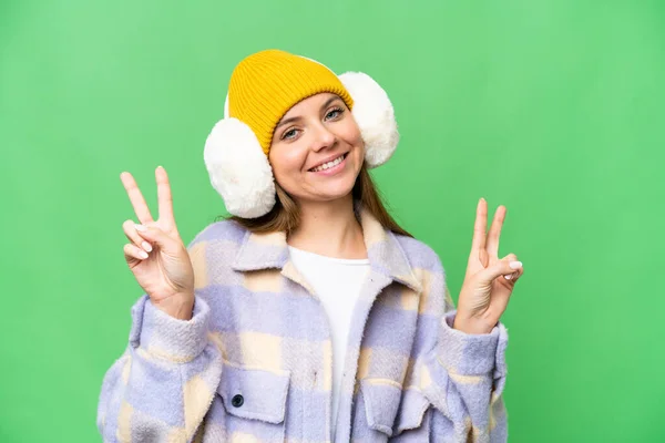Jovem Loira Mulher Vestindo Inverno Muffs Sobre Isolado Chroma Chave — Fotografia de Stock