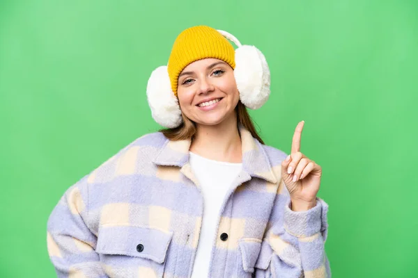 Young Blonde Woman Wearing Winter Muffs Isolated Chroma Key Background — Stock Photo, Image