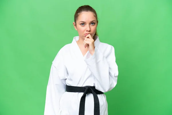 Young Blonde Woman Doing Karate Isolated Chroma Key Background Thinking — Stock Photo, Image