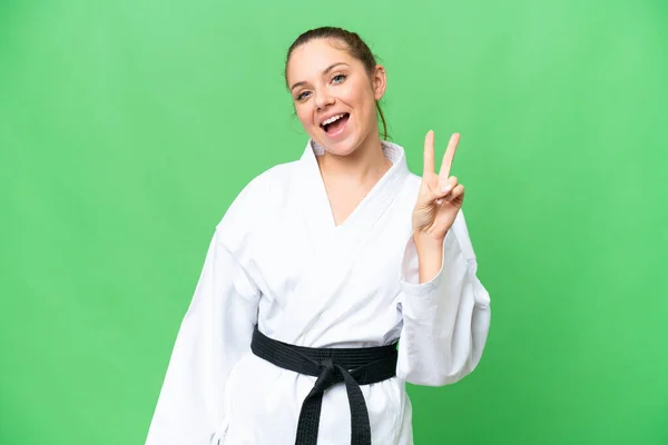 Young Blonde Woman Doing Karate Isolated Chroma Key Background Smiling — Stock Photo, Image