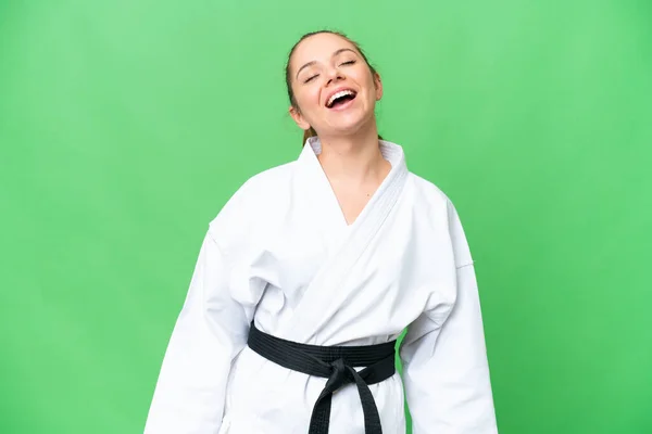 stock image Young blonde woman doing karate over isolated chroma key background laughing