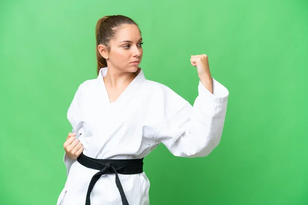 Young Blonde Woman Isolated Chroma Key Background Doing Karate — Stock Photo, Image