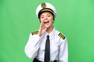 Uçak pilotu kadın izole edilmiş krom anahtar arka planda ağzı açık bağırıyor.