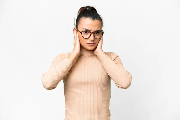 stock image Young beauty woman  over isolated white background frustrated and covering ears