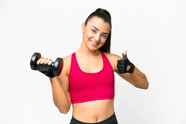 stock image Young sport woman making weightlifting with thumbs up because something good has happened