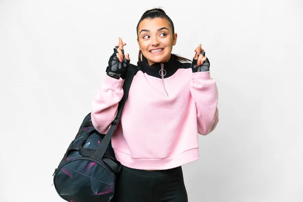 Young Sport Woman Sport Bag Isolated White Background Fingers Crossing — ストック写真