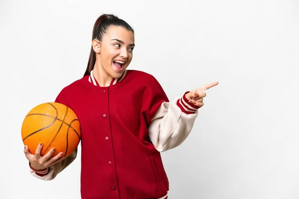 Young Woman Playing Basketball Isolated White Background Pointing Finger Side — Photo
