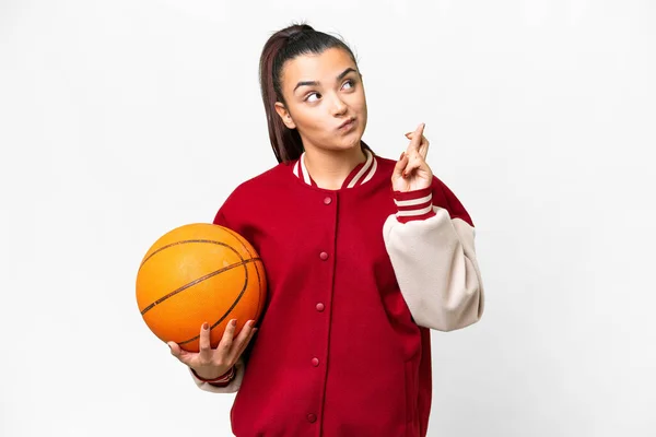 Young Woman Playing Basketball Isolated White Background Fingers Crossing Wishing — ストック写真