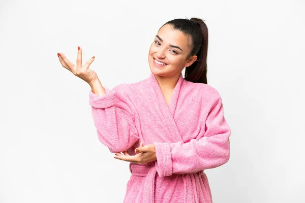 Young Woman Bathrobe Isolated White Background Extending Hands Side Inviting — Stock Photo, Image