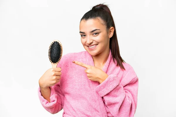 Young Woman Bathrobe Hair Comb Isolated White Background Pointing — Stock Photo, Image