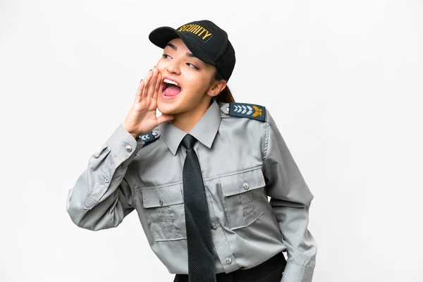 stock image Young safeguard woman over isolated white background shouting with mouth wide open to the lateral