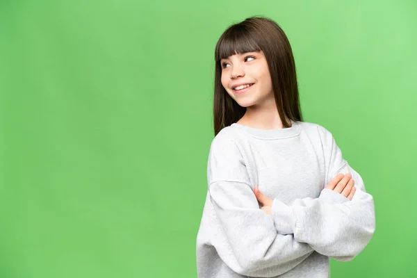 Little Girl Isolated Green Chroma Key Background Looking Side Smiling — Stock Photo, Image