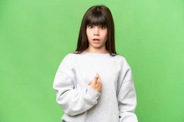 stock image Little girl over isolated green chroma key background pointing to oneself