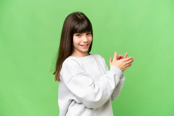 stock image Little girl over isolated green chroma key background applauding