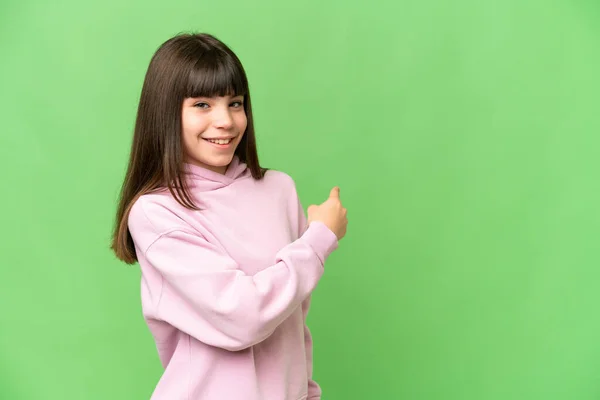 Little Girl Isolated Green Chroma Key Background Pointing Back — Stock Photo, Image