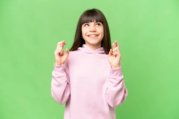 Little Girl Isolated Green Chroma Key Background Fingers Crossing Wishing — Stock Photo, Image