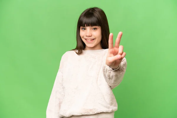 Kleines Mädchen Über Isoliertem Grünem Chroma Schlüsselhintergrund Lächelt Und Zeigt — Stockfoto