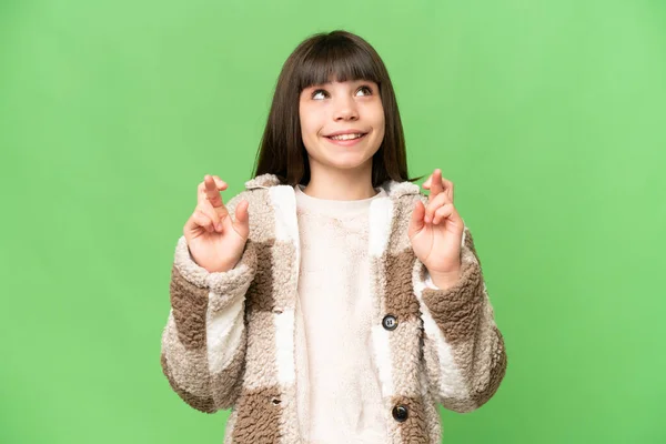 Little Girl Isolated Green Chroma Key Background Fingers Crossing Wishing — Stock Photo, Image