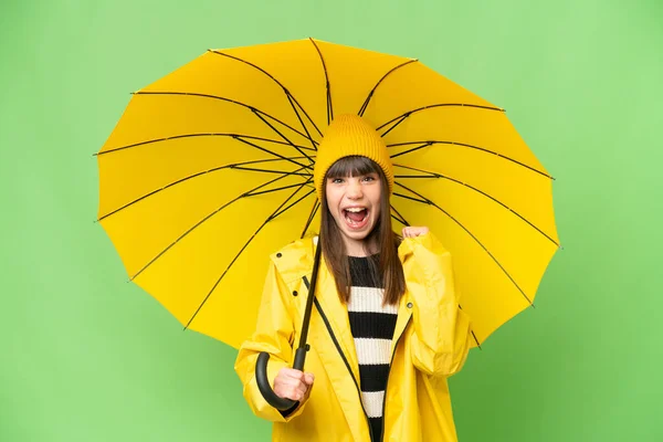 승리를 자축하는 색마의 무지개 코트와 우산을 — 스톡 사진