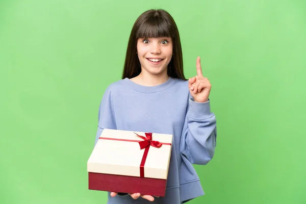 Little Girl Holding Gift Isolated Chroma Key Background Pointing Great — Stock Photo, Image