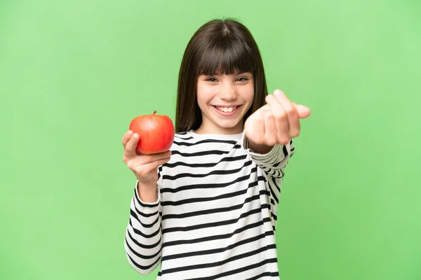 Egy Kislány Egy Almával Elszigetelt Krómkulcsos Háttérrel Aki Meghív Egy — Stock Fotó