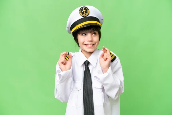 小女孩作为飞行员 用手指在孤立的彩色背景下驾驶飞机 — 图库照片