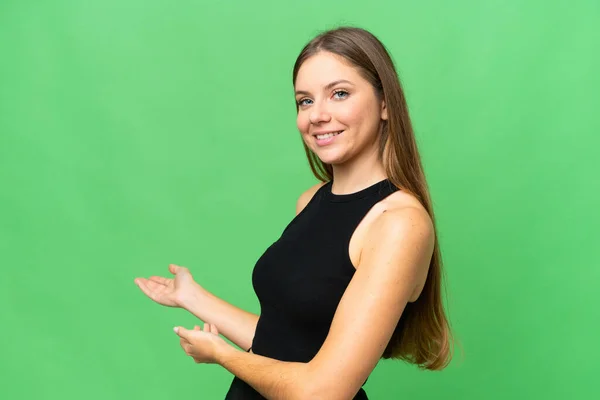 Young Blonde Woman Isolated Chroma Key Background Extending Hands Side — Stock Photo, Image