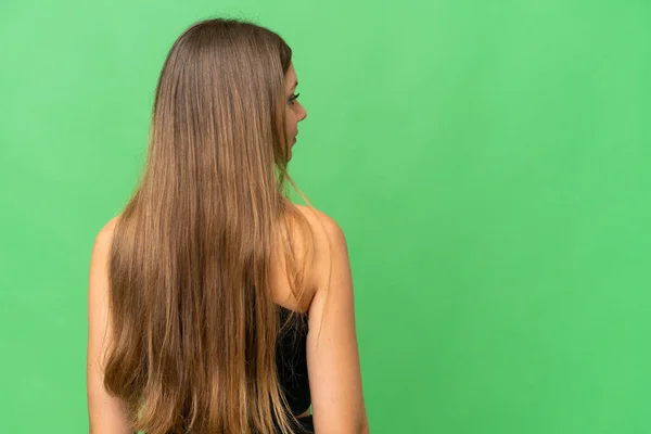 Mujer Rubia Joven Sobre Fondo Croma Clave Aislado Posición Espalda —  Fotos de Stock