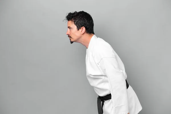 Young Caucasian Man Isolated Grey Background Doing Karate Saluting —  Fotos de Stock