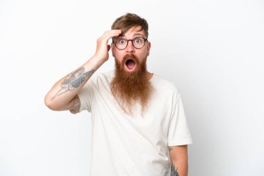 Redhead man with long beard isolated on white background has realized something and intending the solution