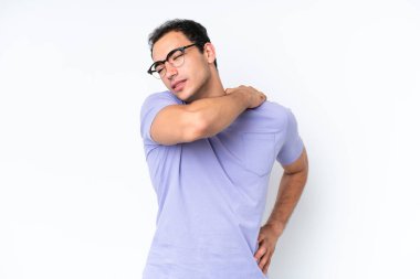 Young caucasian man isolated on white background suffering from pain in shoulder for having made an effort