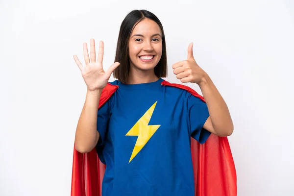 Super Hero caucasian woman isolated on white background counting six with fingers