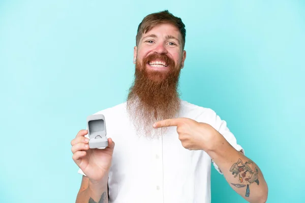 Redhead Man Long Beard Holding Engagement Ring Isolated Blue Background — Stockfoto
