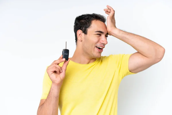 stock image Young caucasian man holding car keys isolated on white background has realized something and intending the solution