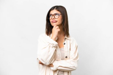 Young Russian woman over isolated white background and looking up