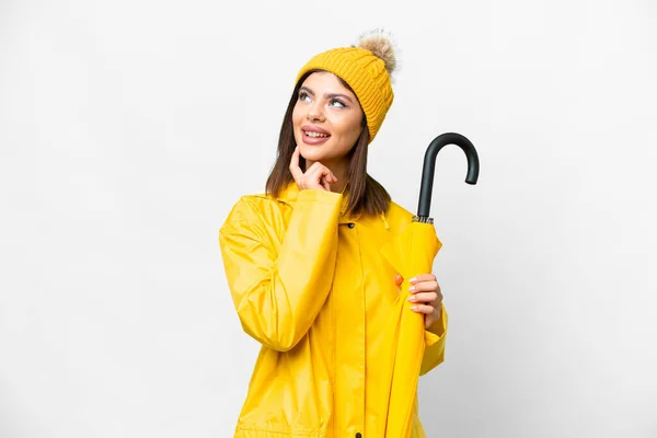 Young Russian Woman Rainproof Coat Umbrella Isolated White Background Thinking — Stock Photo, Image