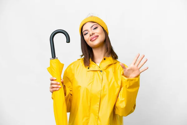 Yağmura Dayanıklı Ceketli Şemsiyeli Genç Rus Kadın Izole Edilmiş Beyaz — Stok fotoğraf