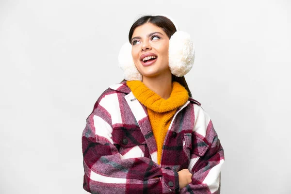 stock image Young Russian woman wearing winter muffs over isolated white background happy and smiling