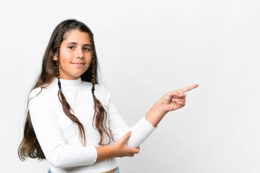Young girl over isolated white background pointing finger to the side