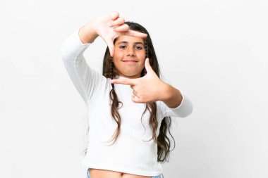 Young girl over isolated white background focusing face. Framing symbol