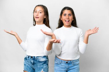 Friends girls over isolated white background with surprise and shocked facial expression