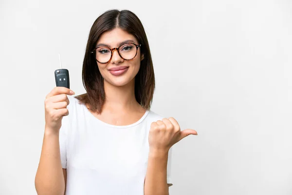 Young Russian Woman Holding Car Keys Isolated White Background Pointing — Φωτογραφία Αρχείου