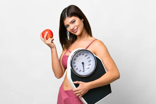 Young Russian Woman Isolated White Background Weighing Machine Apple — Stockfoto