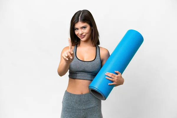 Young Sport Woman Going Yoga Classes While Holding Mat Isolated — Stock fotografie