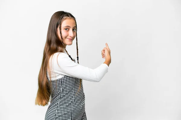 Jeune Fille Sur Fond Blanc Isolé Pointant Vers Arrière — Photo