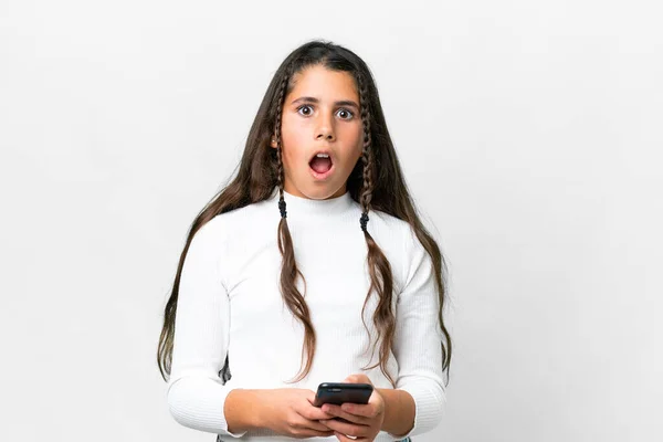 stock image Young girl over isolated white background surprised and sending a message