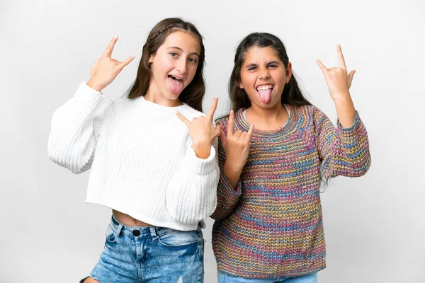 Přátelé Dívky Nad Izolované Bílé Pozadí Dělat Rock Gesto — Stock fotografie