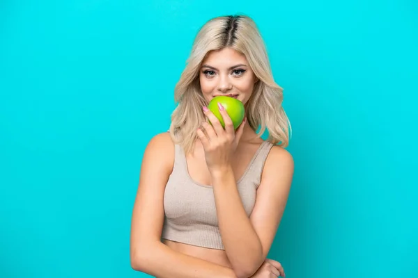 Young Russian Woman Isolated Blue Background Eating Apple — 图库照片