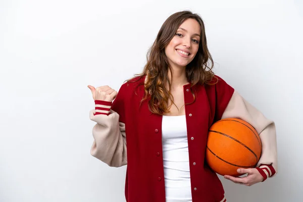 Young Caucasian Woman Playing Basketball Isolated White Background Pointing Side — Stok fotoğraf