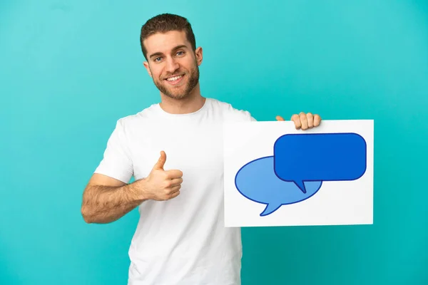 Handsome Blonde Man Isolated Blue Background Holding Placard Speech Bubble — ストック写真